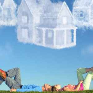lying couple on grass and dream three cloud houses collage
